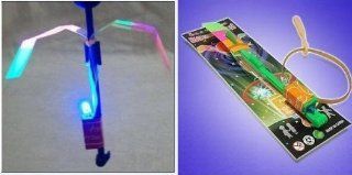 2011 BEST FLYING TOY  LED LIGHT Helicopter Sling Shot (JUST BEND BACK PART DOWN PUSH DOWN TO LIGHT UP AND SHOT FOR THE STARS   SUCH A NEAT TOY  HOURS OF FUN)   BUY A FEW THEY ARE ADDICTING !: Sports & Outdoors