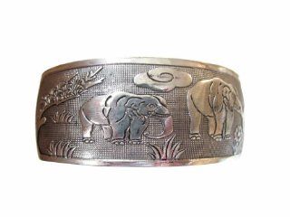 Beautiful Tibetan Silver Bracelet with Recessed Images of the African Elephant: Jewelry
