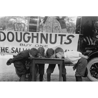 Boys Chow Down on A Table in A Donut Eating Contest Photographic